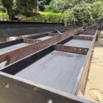 Viga de acero con platinas de conexión en el taller – HFL Ingeniería y Arquitectura